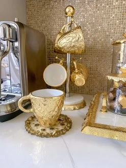 Gold Textured Metal Tea Cup And Saucer With White Interior 13 Gold Textured Metal Tea Cup And Saucer With White Interior -Home Essentials Shop image 4ebb9750 ccb8 474d 8519 93324e3cc9ac